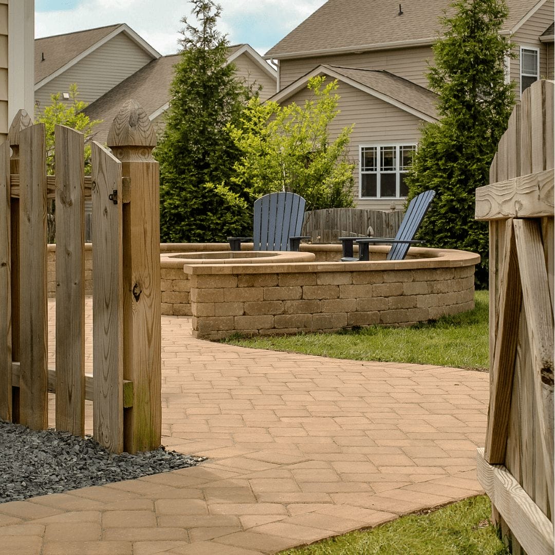 patio with sidewalk, fire pit, seat wall and landscape
